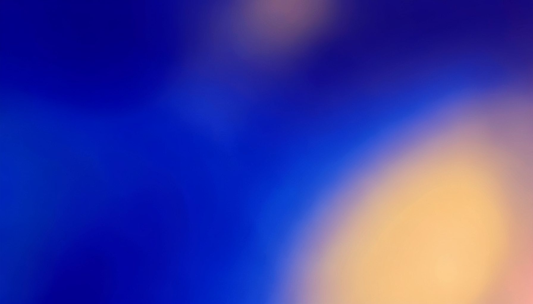 Abstract gradient composition blending deep indigo with soft amber highlights, suggesting scientific inquiry