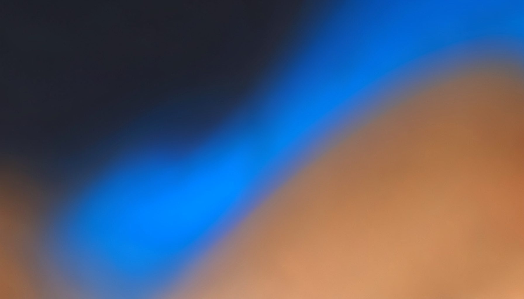 Abstract gradient composition transitioning from dark slate to warm copper, suggesting chemical analysis